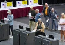 Election officials are fighting wavering voter trust by making mundane processes visible and recruiting citizens to help